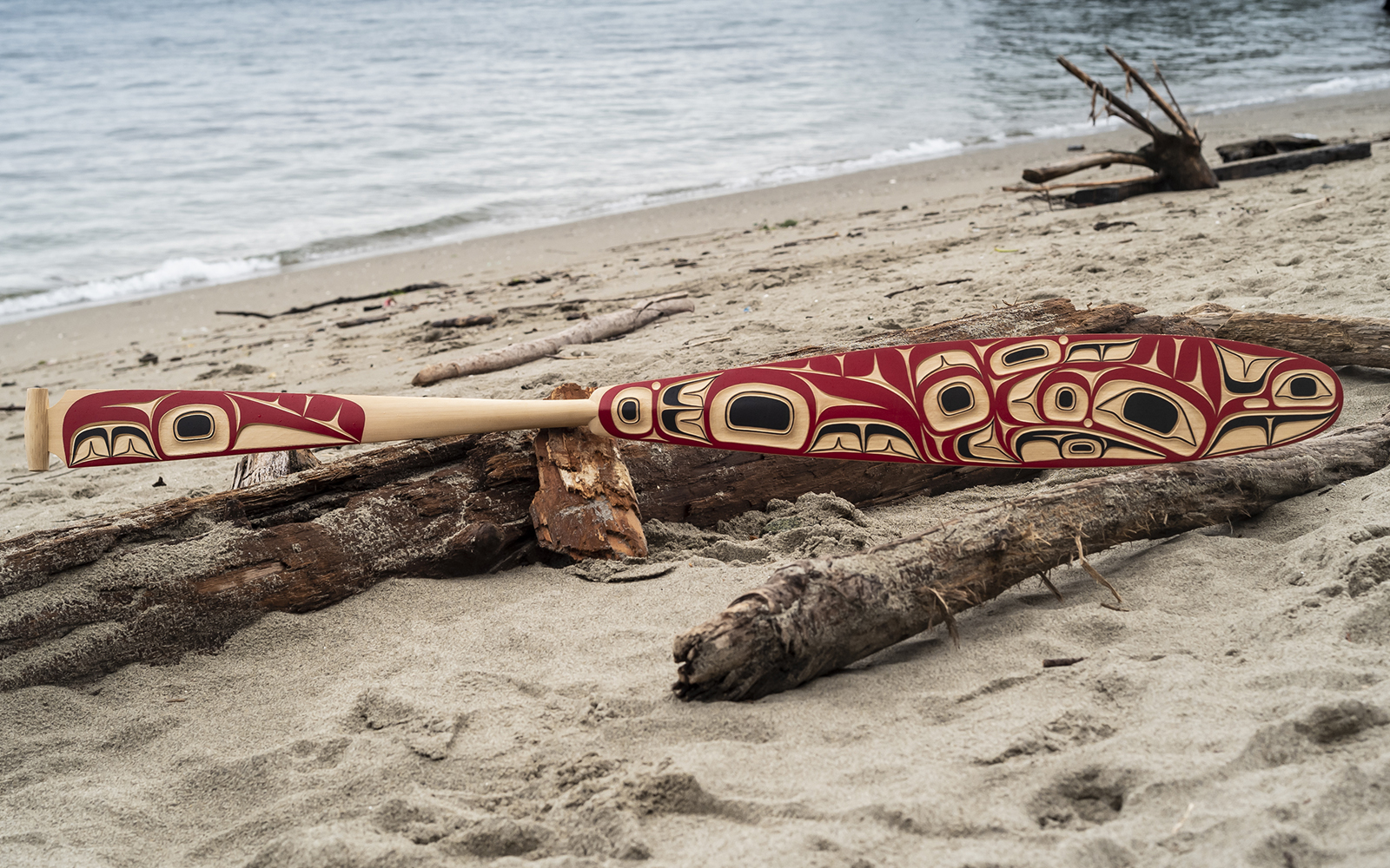 carved art on wooden paddle