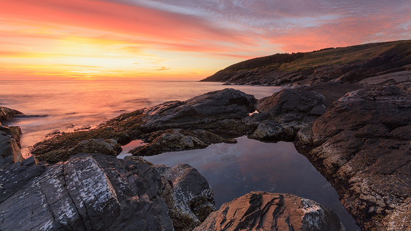 Sunset at a rocky waterside 