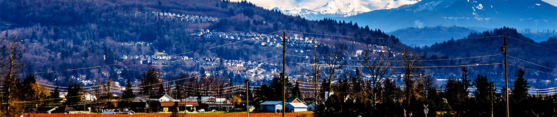 Small town nestled in snow-covered mountains.