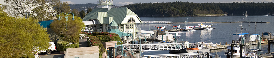 Docks on the water with seaplanes sitting at the docks.