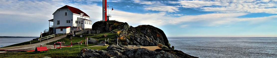 White house on a cliff over the ocean