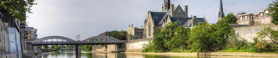 View from canal of a bridge and a church