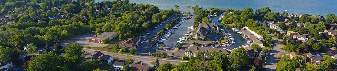 Aerial view of a small port with many boats docked.