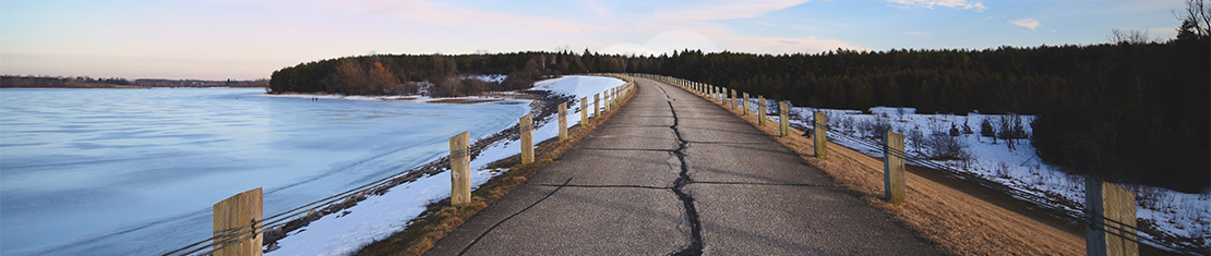 Small road surrounded by snow
