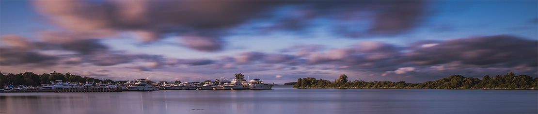 Dark, purple clouds over a body of water