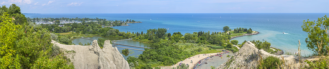 Coast of a large body of water from a mountain above.