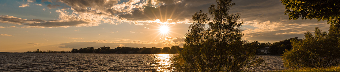 Body of water reflecting an early morning sun